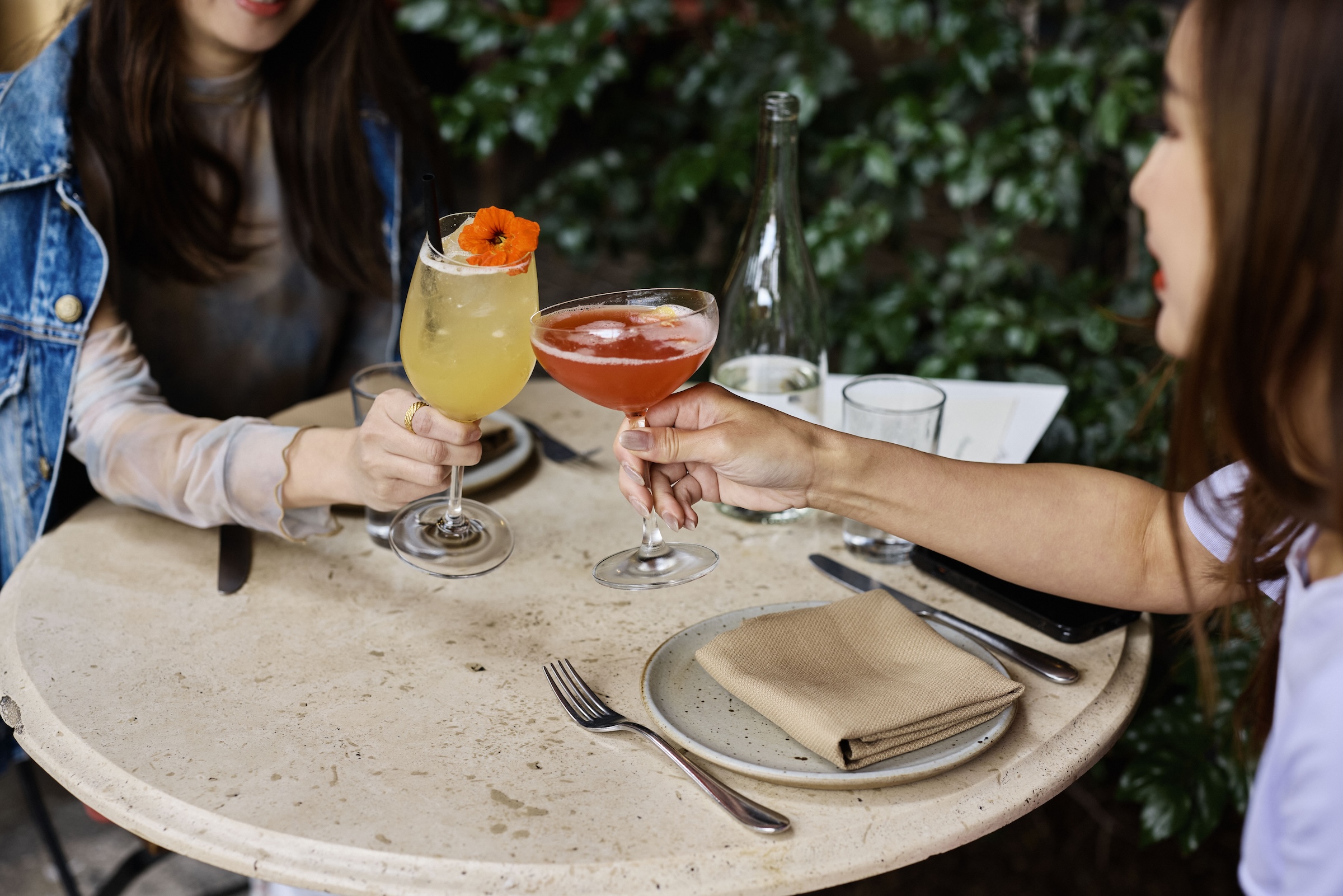 a couple of people holding drinks